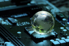 Concept of green technology. crystal globe on circuit board technology innovations. Environment Green Technology Computer Chip.Green Computing and Technology, CSR, and IT ethics, Ai.