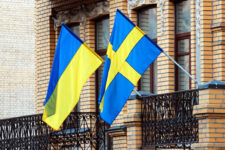 Swedish and Ukrainian flags on a balcony in Kiev, Ukraine