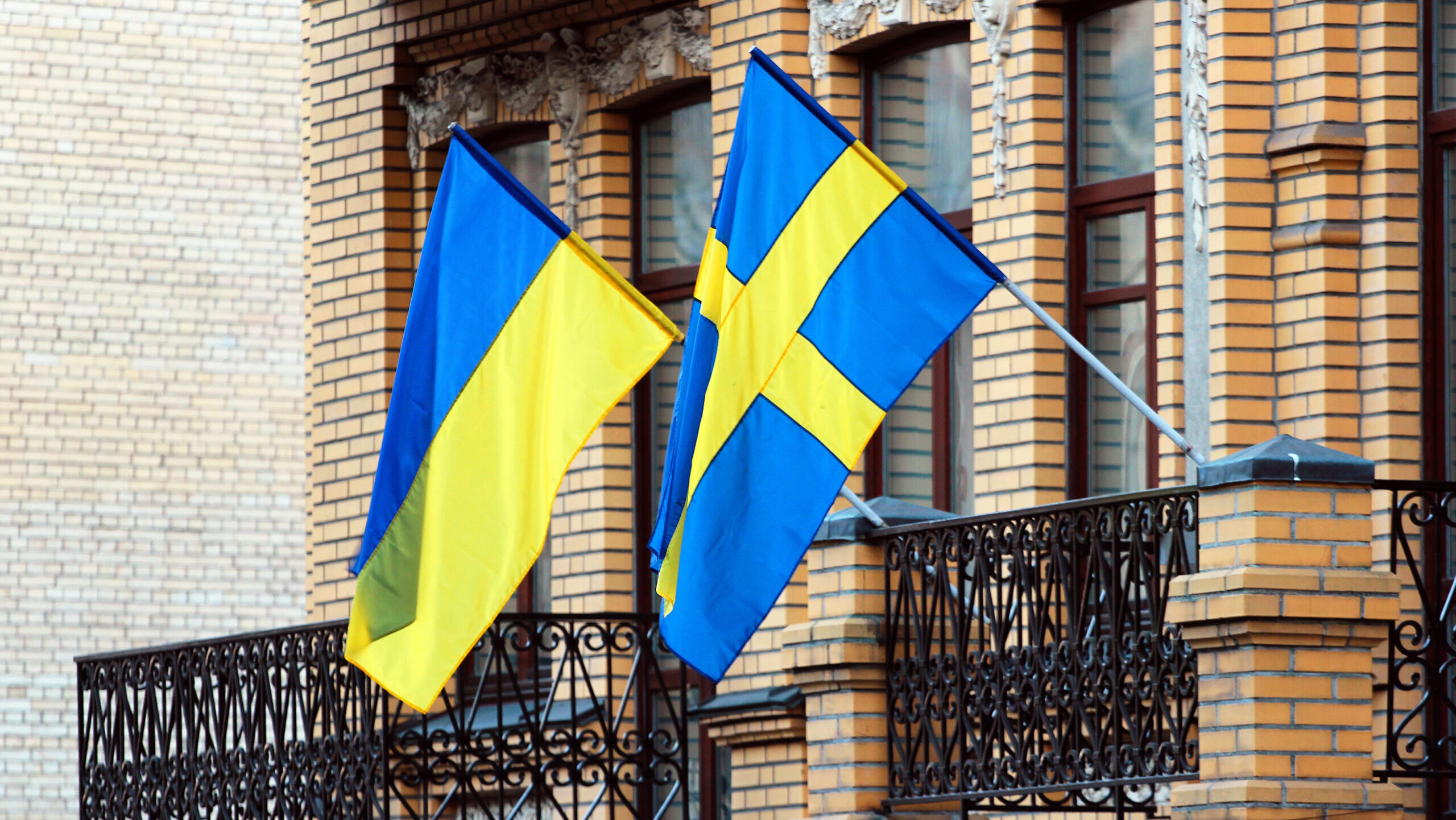 Swedish and Ukrainian flags on a balcony in Kiev, Ukraine