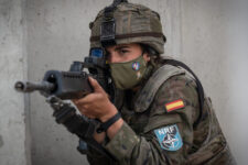 A Spanish Soldier assigned to the BRILAT Brigade aims her HK G36 rifle while holding her position conducting urban combat training during Exercise Steadfast Defender 2021