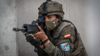 A Spanish Soldier assigned to the BRILAT Brigade aims her HK G36 rifle while holding her position conducting urban combat training during Exercise Steadfast Defender 2021